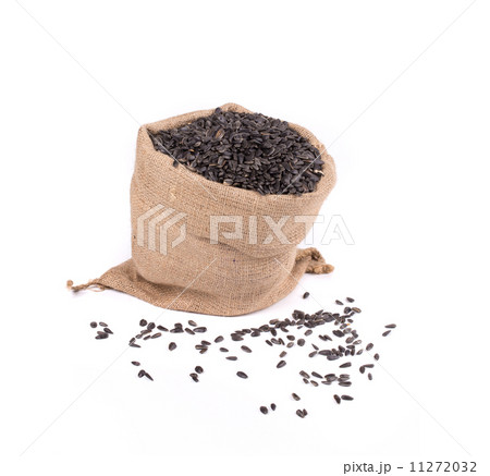 Close up of black sunflower seeds in bag. 11272032