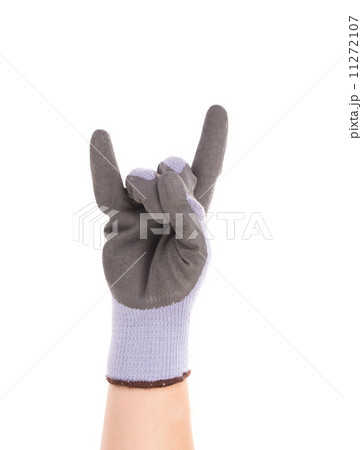 Hand shows rock sign in rubber glove. 11272107