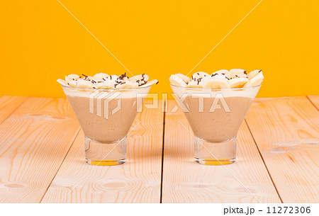 Banana milk smoothie in glass. Side view. Banana milk smoothie in glass. Side view. 11272306