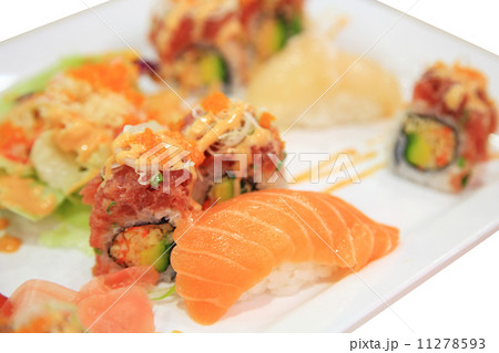 Salmon sushi and spicy tuna rolls on plate isolated Salmon sushi and spicy tuna rolls on plate isolated 11278593