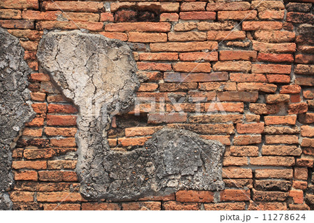 Vintage brick wall with cracked concrete Vintage brick wall with cracked concrete 11278624