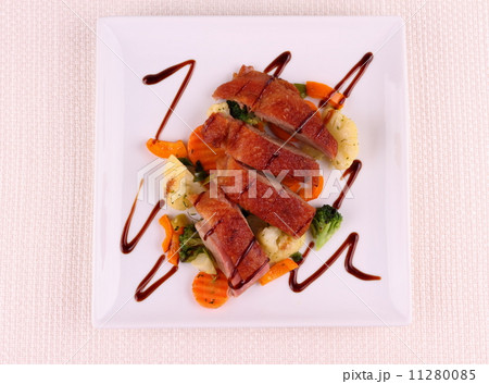 Roasted duck breast, vegetables, black sauce Roasted duck breast, vegetables, black sauce 11280085