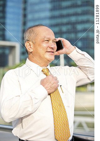 Senior business executive talking on smart phone 11281899