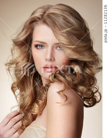 Sophisticated Woman with Perfect Skin and Flowing Blond Healthy Hair 11282136