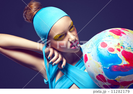 Grotesque. Eccentric Woman with Fancy Stagy Makeup and Air Balloon Grotesque. Eccentric Woman with Fancy Stagy Makeup and Air Balloon 11282179