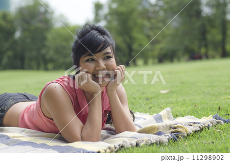 Portrait Of Asian Young Smiling Girl In Park Portrait Of Asian Young Smiling Girl In Park 11298902