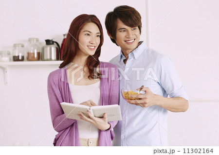 Couple Cooking Healthy Food In Kitchen Lifestyle Meal Preparation Couple Cooking Healthy Food In Kitchen Lifestyle Meal Preparation 11302164