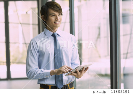 Young Business Male in Urban Setting Young Business Male in Urban Setting 11302191