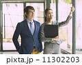 Young Business Partners in Urban Setting 11302203