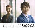 Young Business Partners in Urban Setting 11302208