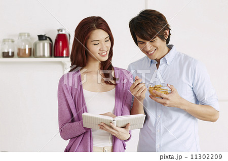 Couple Cooking Healthy Food In Kitchen Lifestyle Meal Preparation Couple Cooking Healthy Food In Kitchen Lifestyle Meal Preparation 11302209