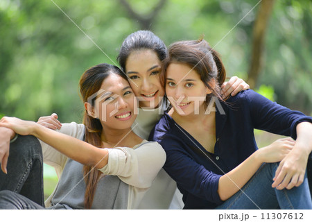 asian women relax in park, friendship 11307612