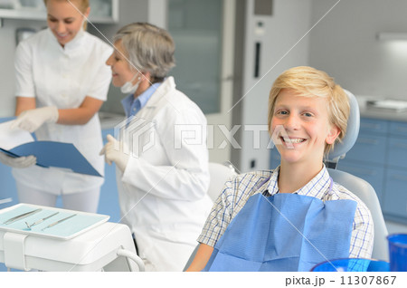 Dental checkup teenage patient and dentist nurse Dental checkup teenage patient and dentist nurse 11307867