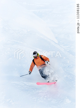 Freeride skier in powder snow Freeride skier in powder snow 11308186