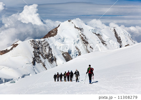 Mountaneers walking on a glacier Mountaneers walking on a glacier 11308279