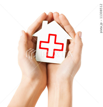 hands holding paper house with red cross hands holding paper house with red cross 11308512
