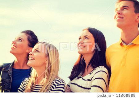 group of friends looking up on the beach 11308989
