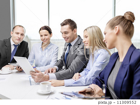 business team with tablet pc having discussion business team with tablet pc having discussion 11309552