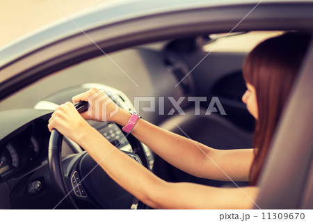 happy woman driving a car 11309670