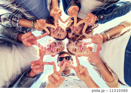 group of teenagers showing finger five 11310366