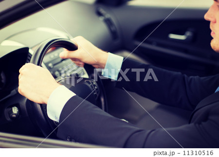 businessman driving a car 11310516