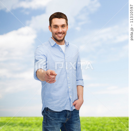 smiling man pointing finger at you 11310597