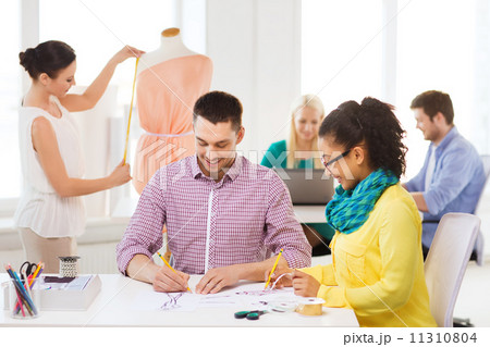 smiling fashion designers working in office smiling fashion designers working in office 11310804