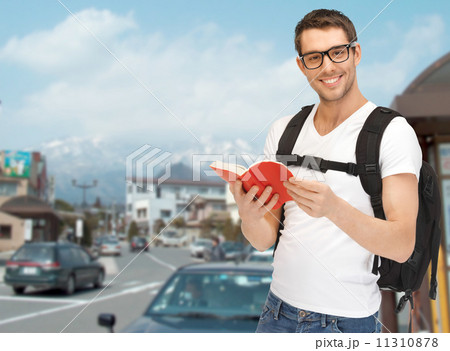 travelling student with backpack and book travelling student with backpack and book 11310878