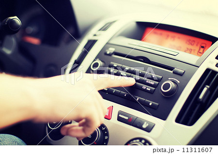 man using car audio stereo system man using car audio stereo system 11311607