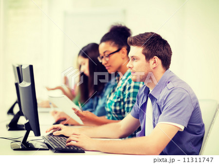 students with computers studying at school 11311747