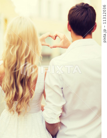 romantic couple in the city making heart shape romantic couple in the city making heart shape 11312036