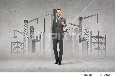 handsome businessman showing thumbs up handsome businessman showing thumbs up 11312081