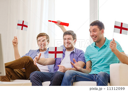 happy male friends with flags and vuvuzela 11312099