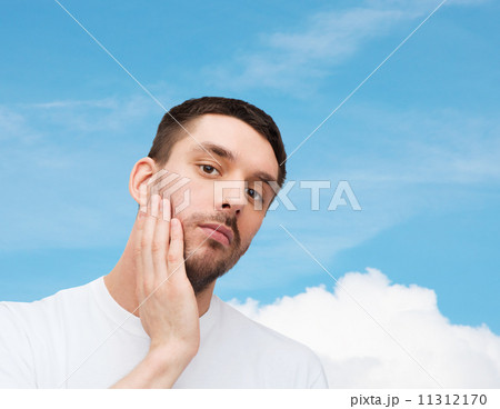 beautiful calm man touching his face 11312170