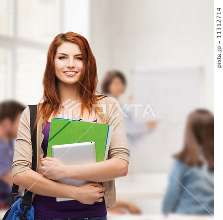 smiling student with bag, folders and tablet pc smiling student with bag, folders and tablet pc 11312714