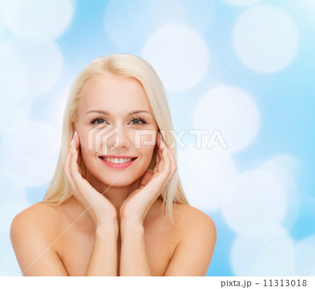beautiful woman touching her face skin 11313018