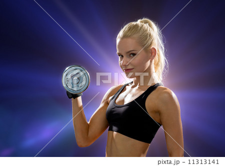 young sporty woman with heavy steel dumbbell young sporty woman with heavy steel dumbbell 11313141