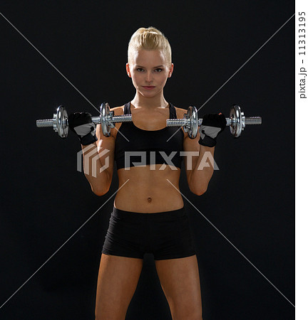 sporty woman with heavy steel dumbbells sporty woman with heavy steel dumbbells 11313195