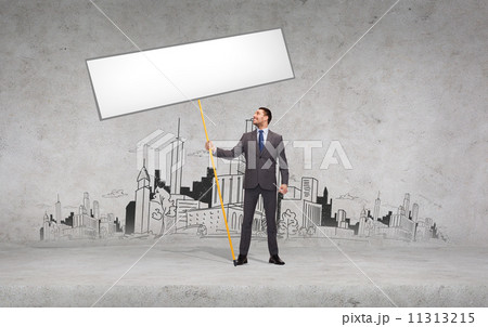 smiling businessman holding white blank board smiling businessman holding white blank board 11313215