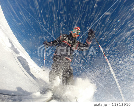 Downhill alpine skiing at high speed on powder snow. 11313916