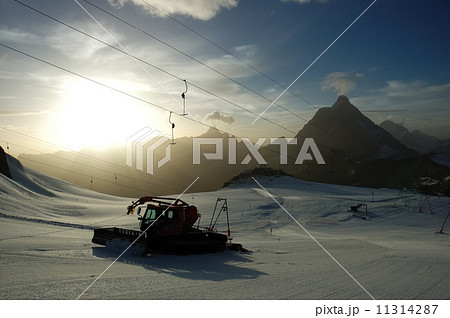 Sunset ski slope snowplow Sunset ski slope snowplow 11314287