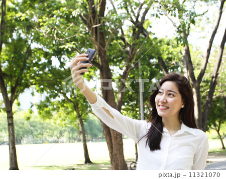 Close up portrait of Asian woman use mobile phone Close up portrait of Asian woman use mobile phone 11321070