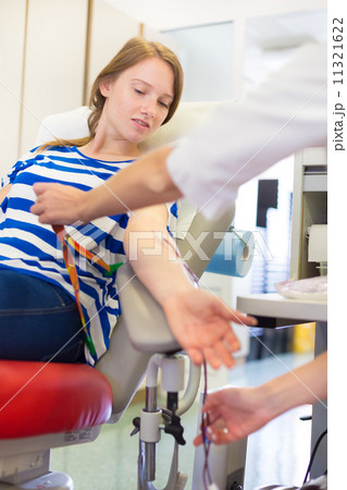 Nurse and blood donor at donation. 11321622