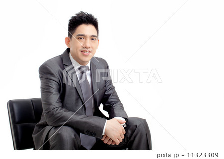Businessman Sitting and Smiling 11323309