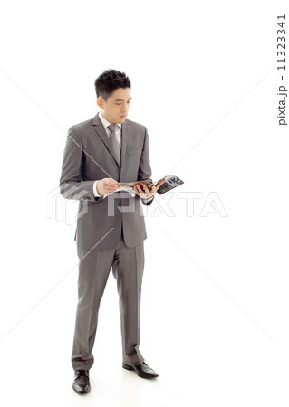 Businessman with Magazine 11323341