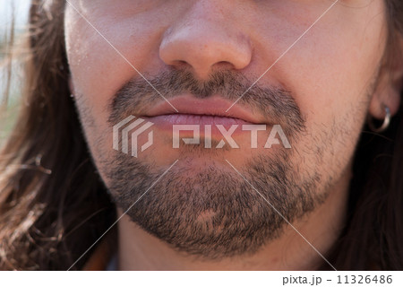 Part of face young European man with beard. 11326486