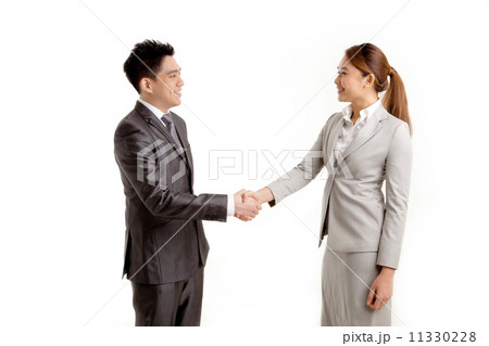 Businessman and Businesswoman Shaking Hands 11330228