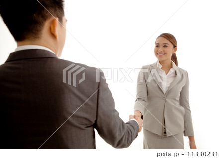Businesswoman and Businessman Shaking Hands Businesswoman and Businessman Shaking Hands 11330231