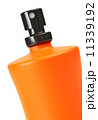 orange small bottle with a perfume liquid 11339192
