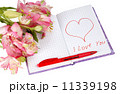 notebook with flowers by a heart and inscription 11339198